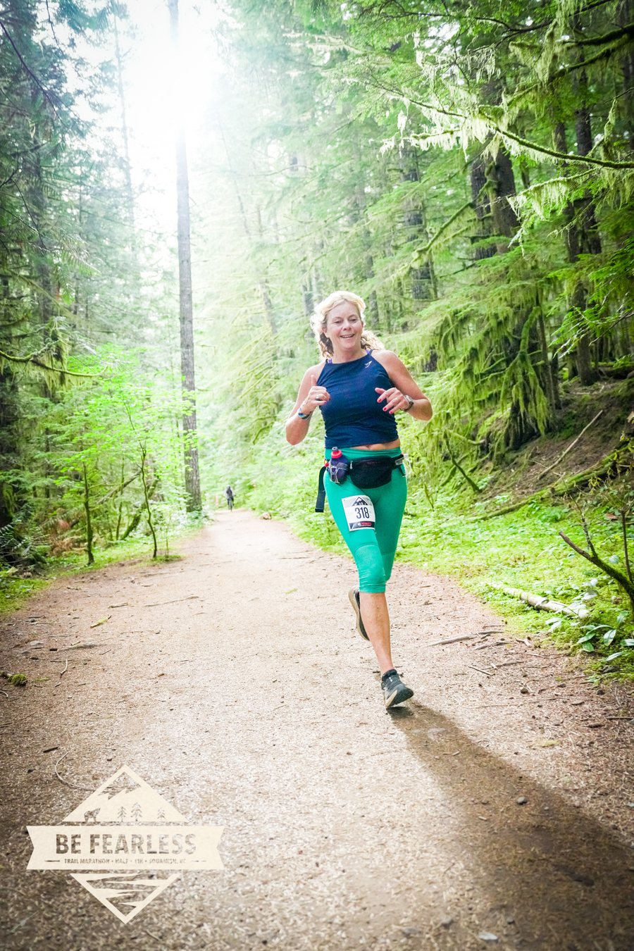 Helmy running the Be Fearless trail race in Squamish, grinning